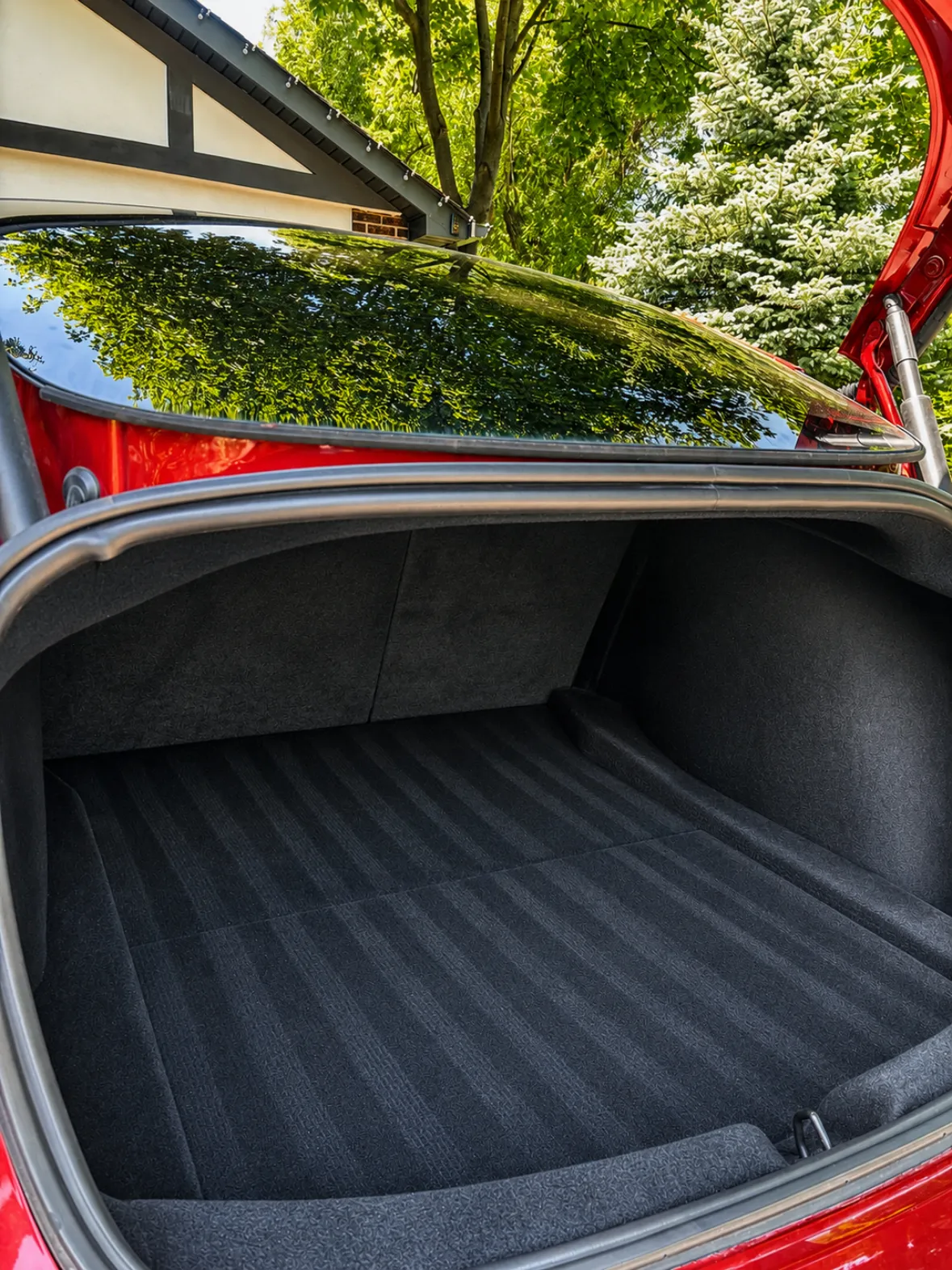 Trunk carpet with clean vacuum lines after an interior detail